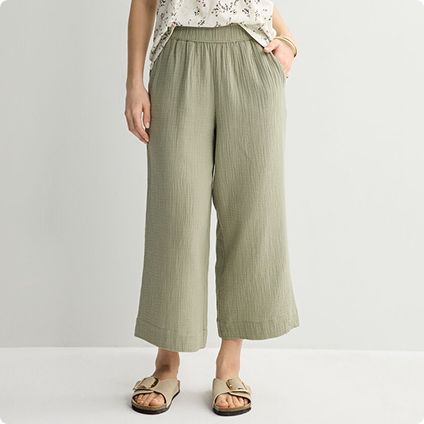 Person wearing sage green cropped pants