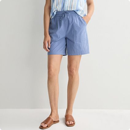 Person wearing blue drawstring shorts