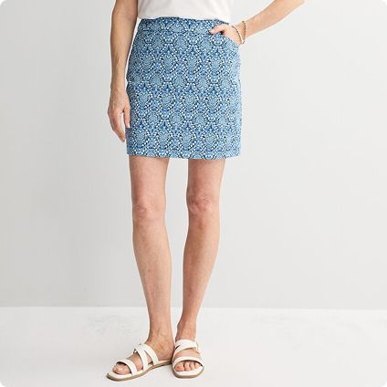 Woman in blue patterned mini skirt