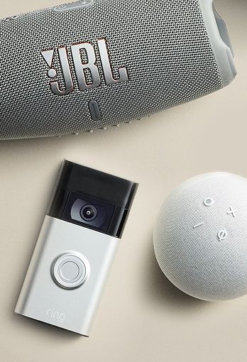 Collection of various electronic items, include a doorbell camera and a bluetooth speaker.