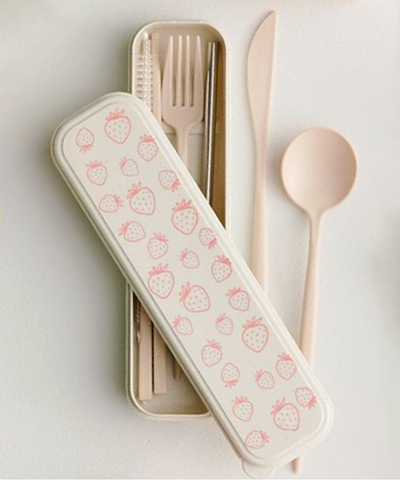 Beige cuttlery set with a container covered in pink strawberries designs.