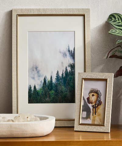 Drapes of different neutral color tones hanging with overlap.