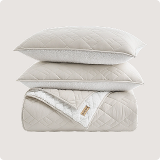 Cream colored blanket folded into a square.