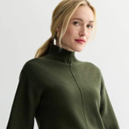 Model wearing a green zipped sweater.