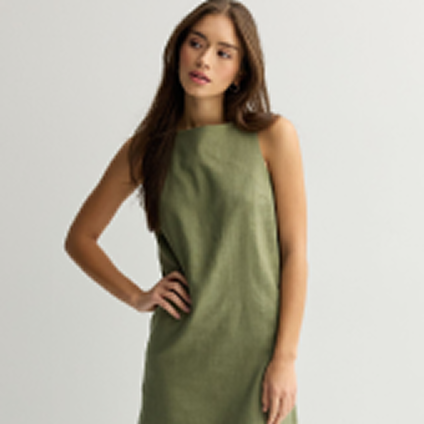 Model wearing a green dress.