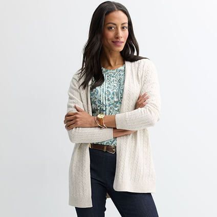 Model in with arms crossed in a long sweater