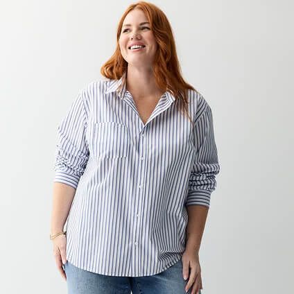 Model wearing a striped button down top and jeans.