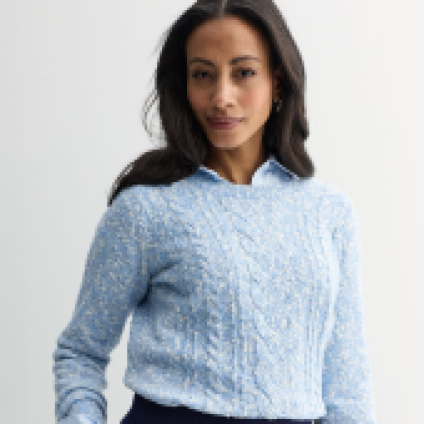 Model wearing a green zipped sweater.