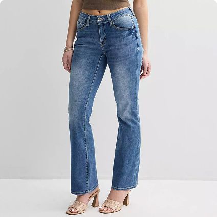 Woman wearing juniors’ curvy-fit jeans