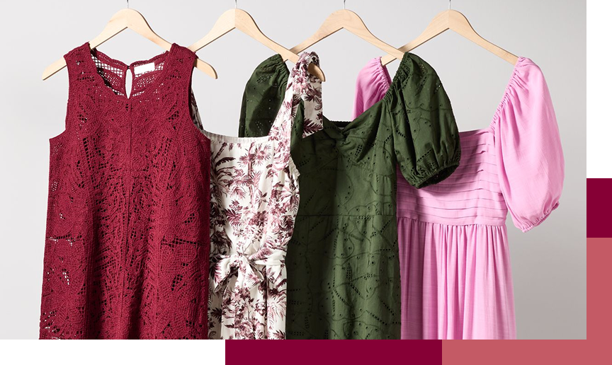 Four dresses on hangers: burgundy lace, floral print, dark green, and pink.