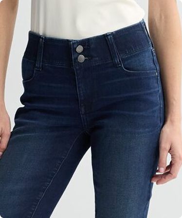 Close-up of a woman wearing mid-rise jeans