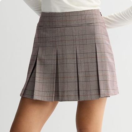 Woman wearing a pleated skirt