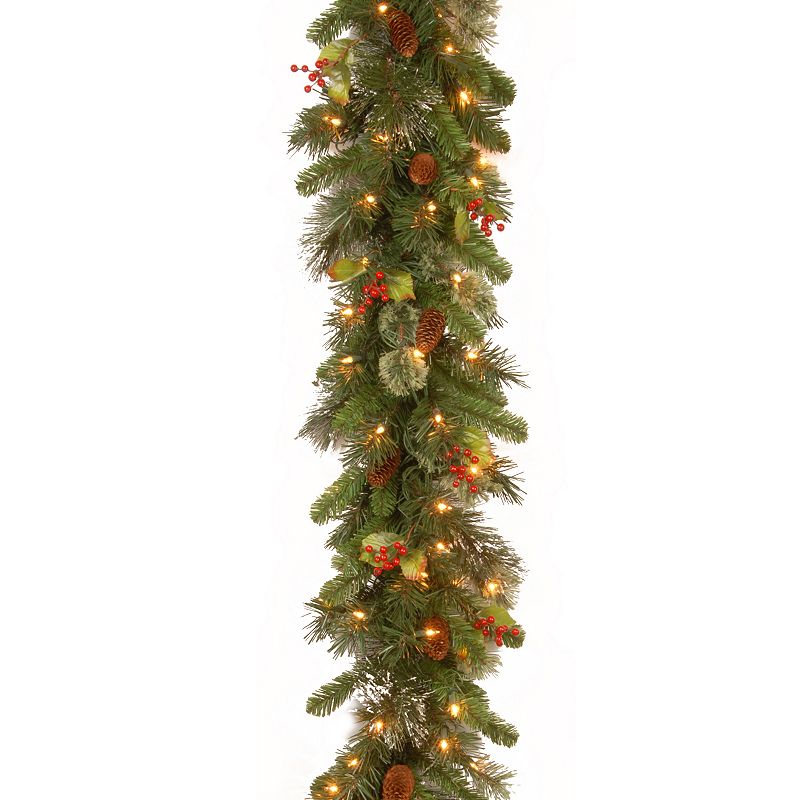 National Tree Company Pre-Lit Artificial Christmas Garland  Green  Wintry Pine  White Lights  Decorated with Pine Cones  Berry Clusters  Plug In  Christmas Collection  9 Feet