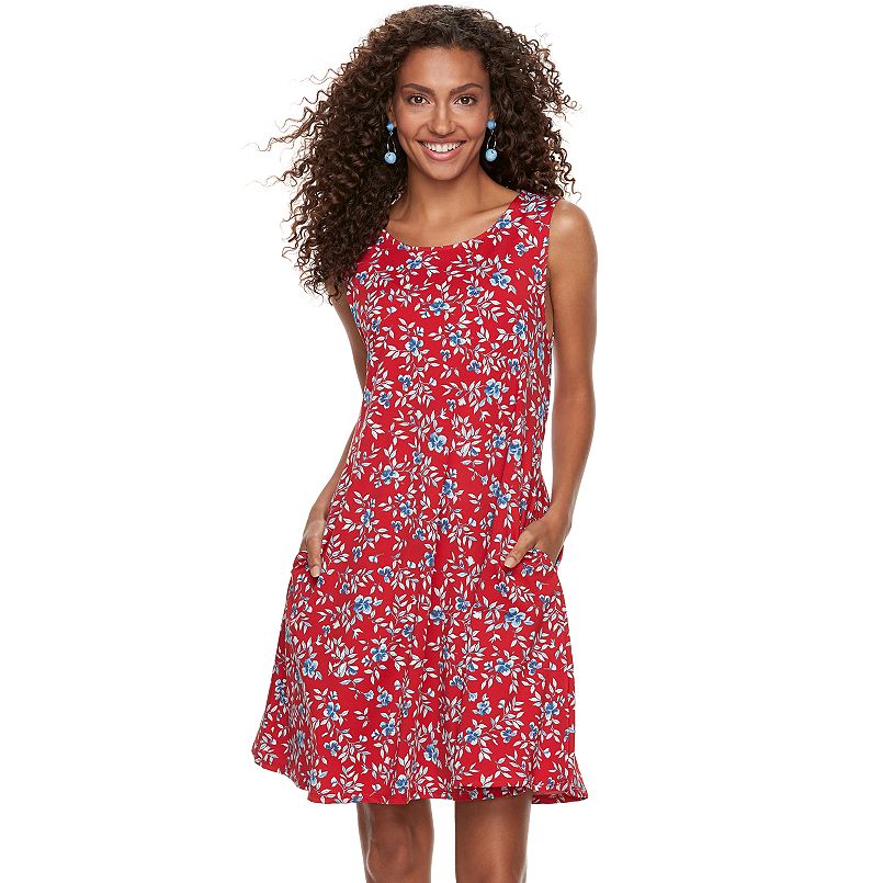 woman wearing red floral swing dress