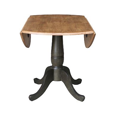 International Concepts Pedestal Round Dual Drop Leaf Dining Table