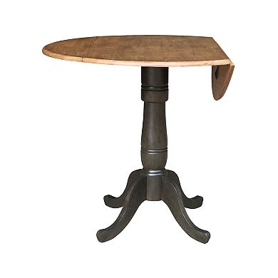 International Concepts Round Pedestal Dual Drop Leaf Dining Table