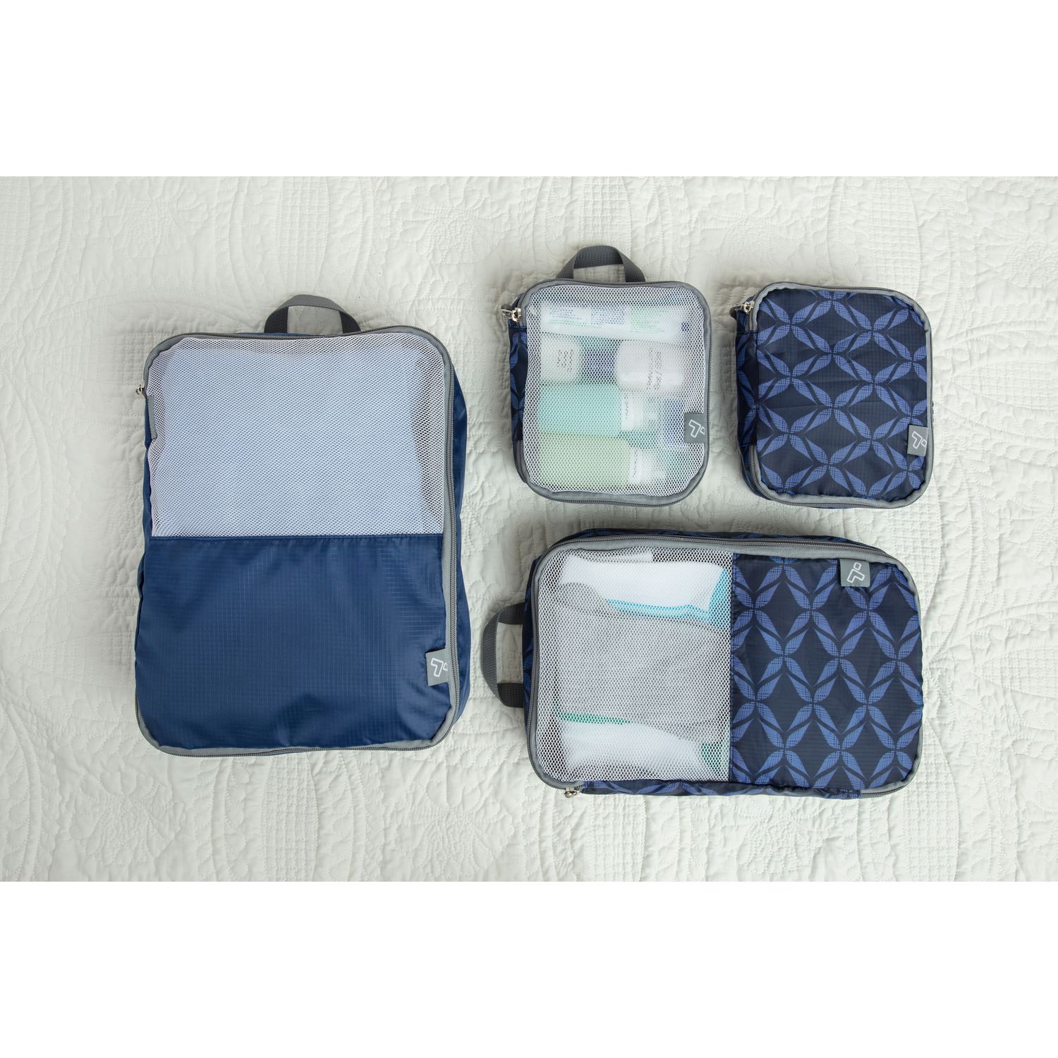 Packing cubes keep your clothes organized in a suitcase.
