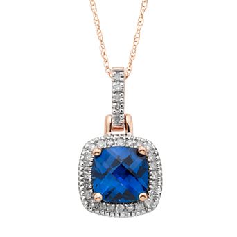 10k Gold Lab-Created Blue Sapphire & 1/8 Carat T.W. Diamond Halo Pendant Necklace