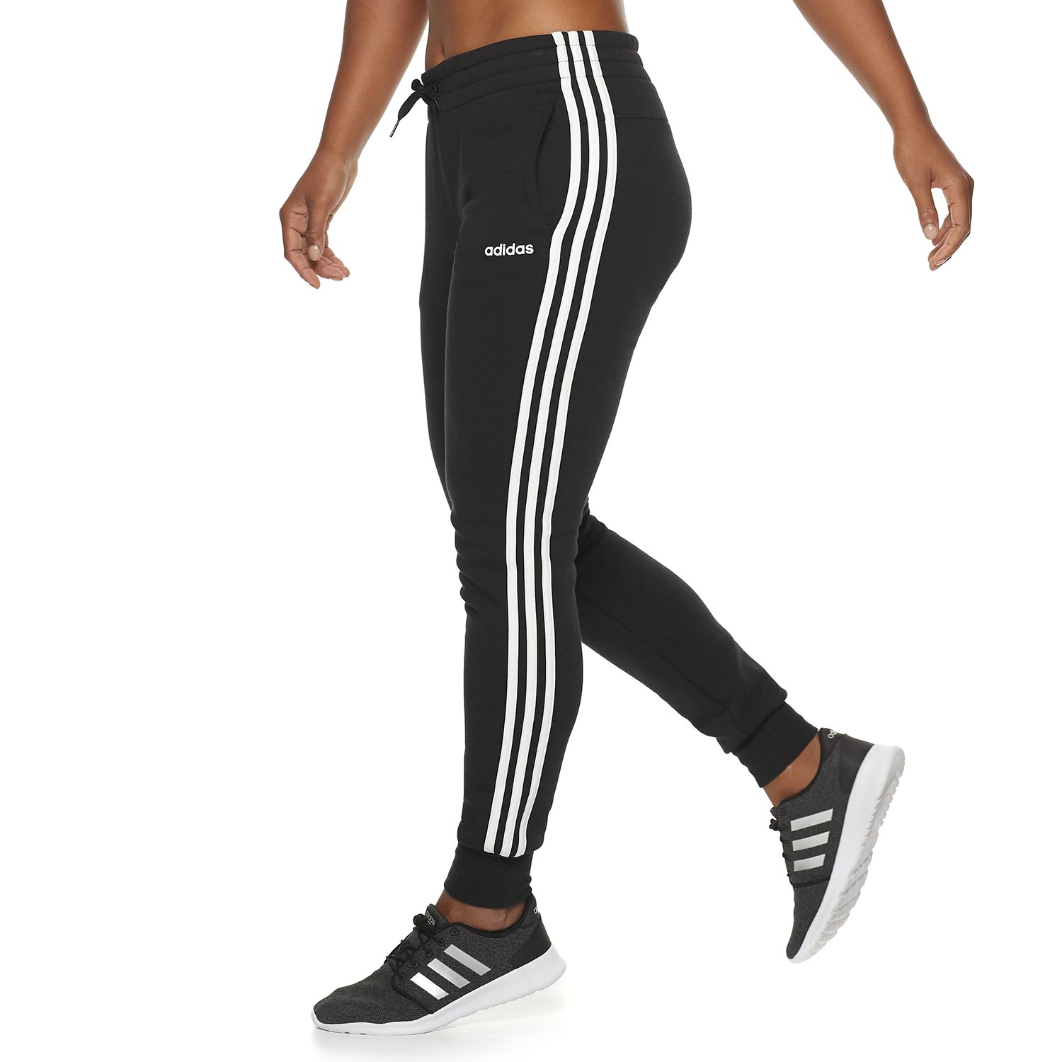 white adidas pants with black stripes