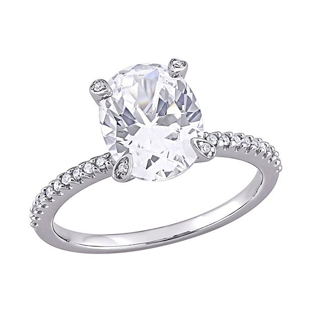 Oval Lab-Created White Sapphire and 1/6 CT. T.W. Diamond Frame