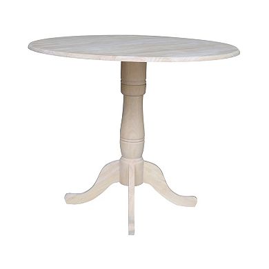 International Concepts Round Dual Drop Leaf Pedestal Table