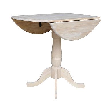 International Concepts Round Dual Drop Leaf Pedestal Table