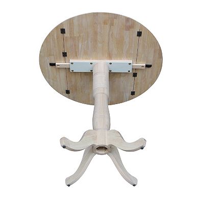 International Concepts Round Dual Drop Leaf Pedestal Table