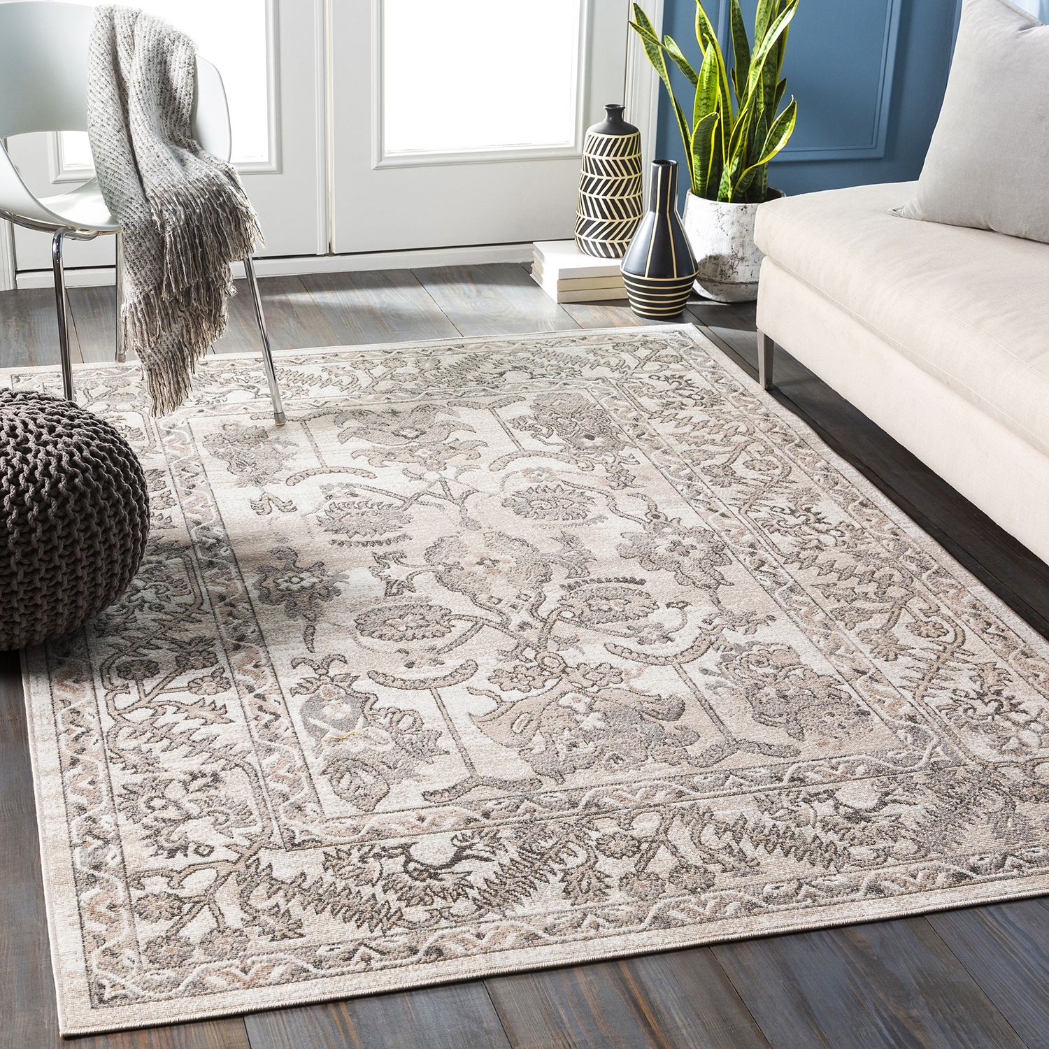 An area rug ties an entire room's look together, and offers cushioning and comfort with every step.