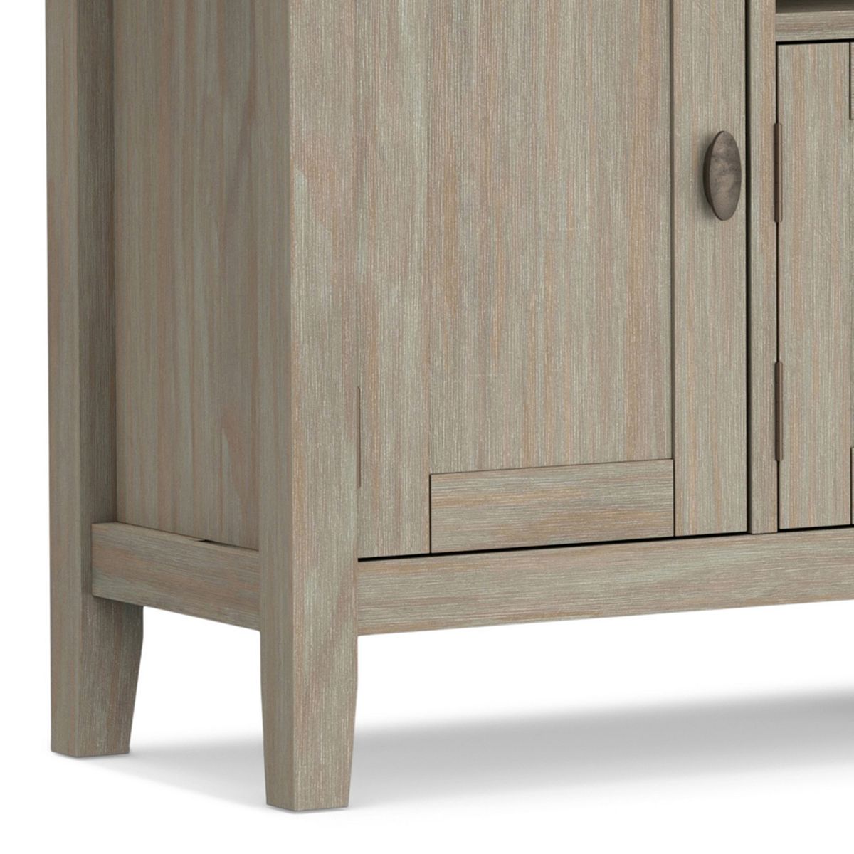 Lower corner of light gray Redmond TV media stand cabinet with tapered leg.