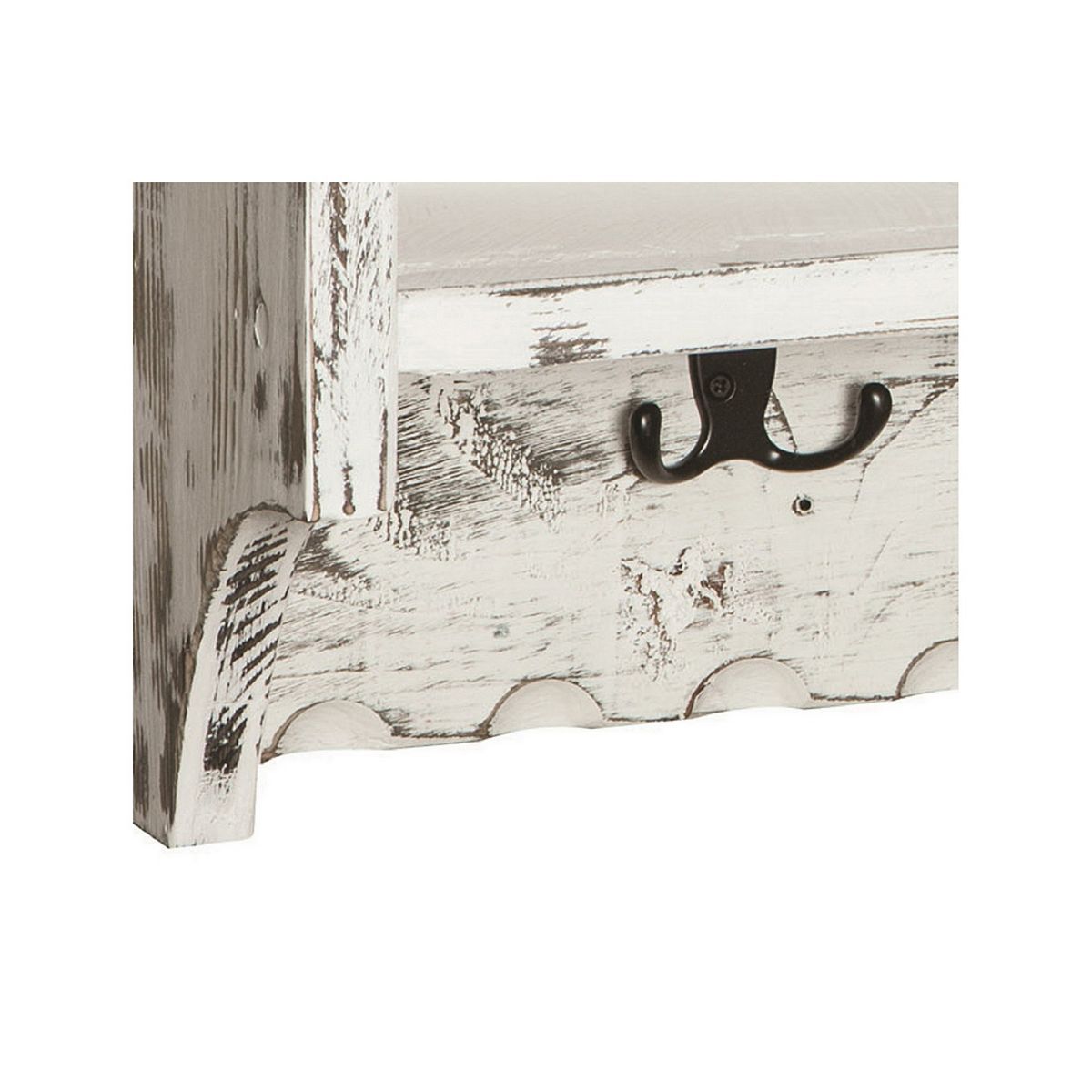 Close-up of distressed wood shelf corner with wall hooks
