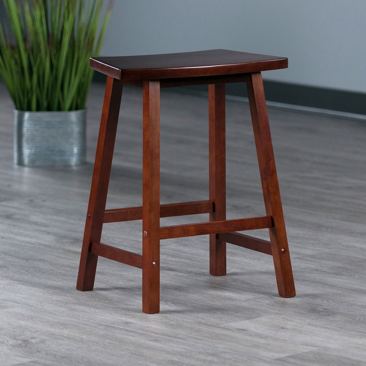 Dark wood Katashi counter stool with squared seat and open frame base