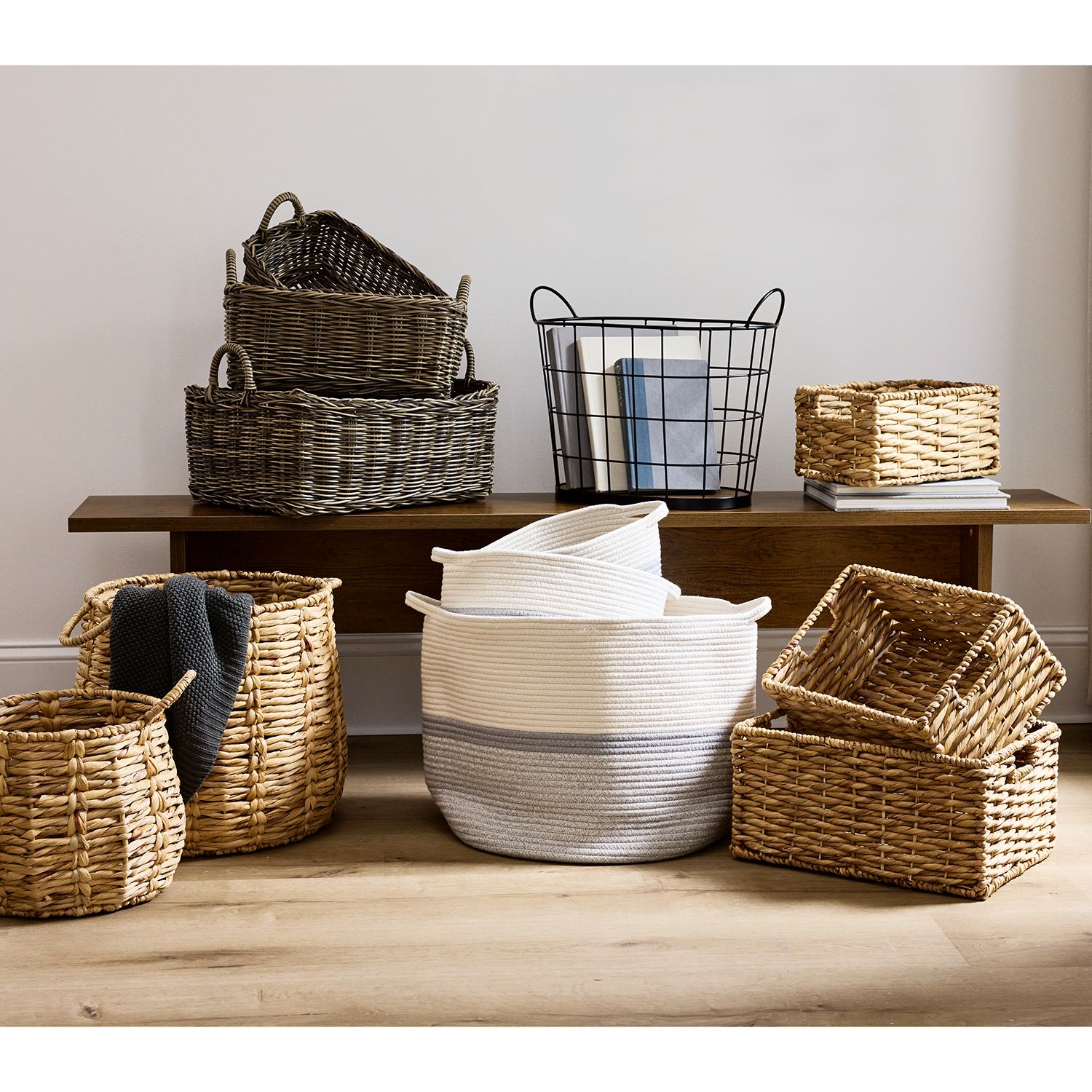 Woven baskets hold room essentials like blankets and throw pillows, keeping your space clutter-free.