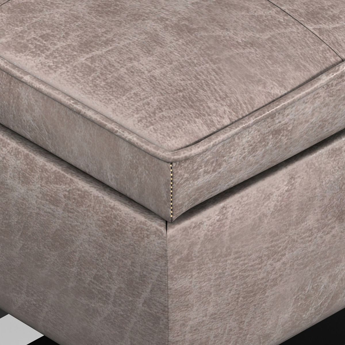Corner view of upholstered storage bench with stitched seam lines