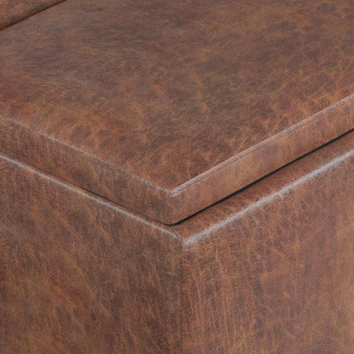 Close-up of faux leather upholstery on Avalon storage ottoman