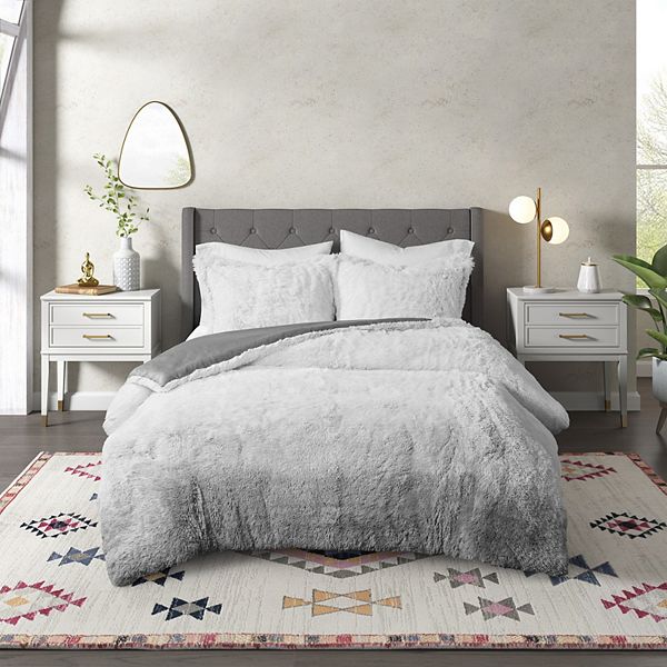 Velvet face fabric is enriched with a cable knit design reminiscent of your favorite sweater. cosmoliving by cosmopolitan cleo ombre shaggy faux fur comforter set