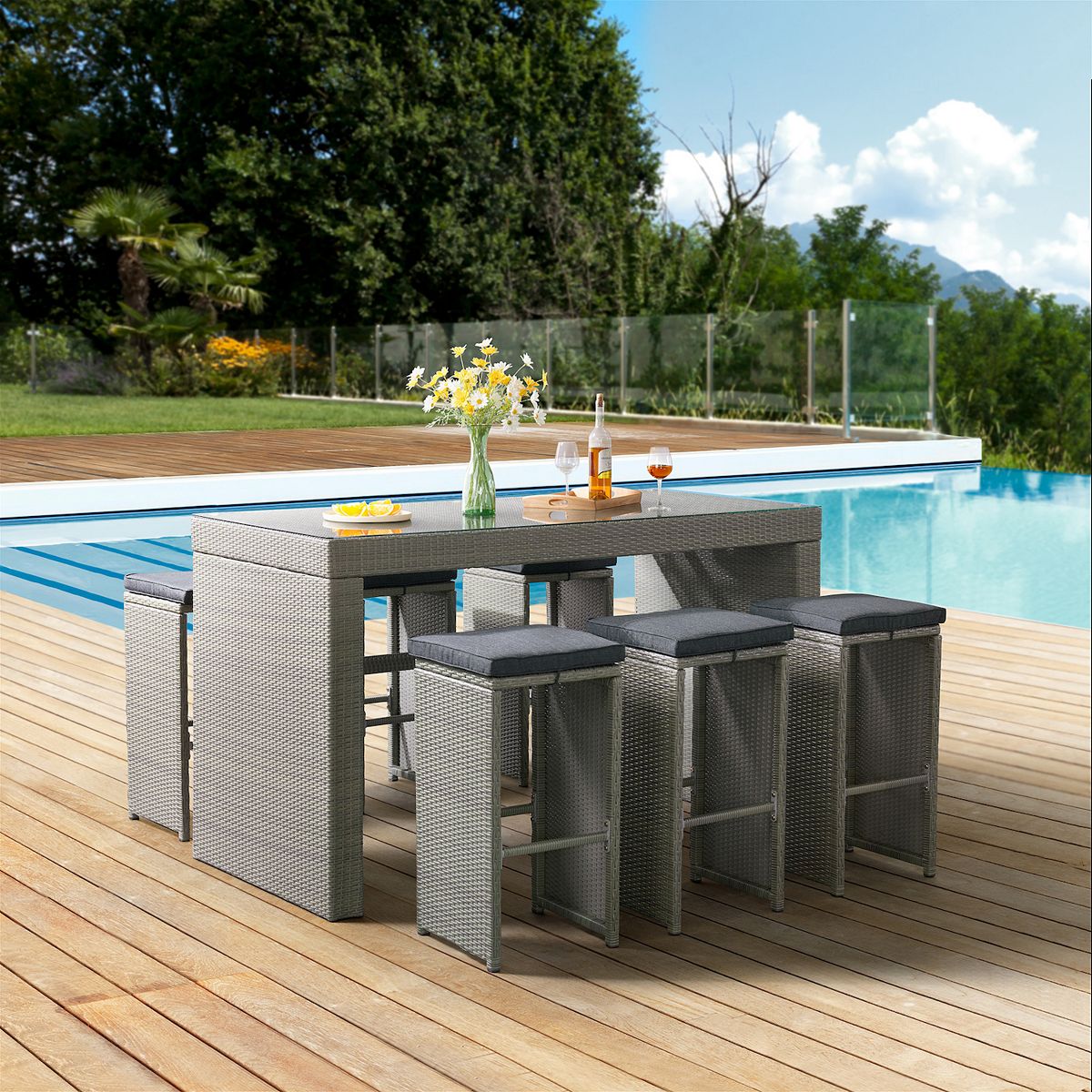All-weather wicker bar stool set arranged outdoors by a pool