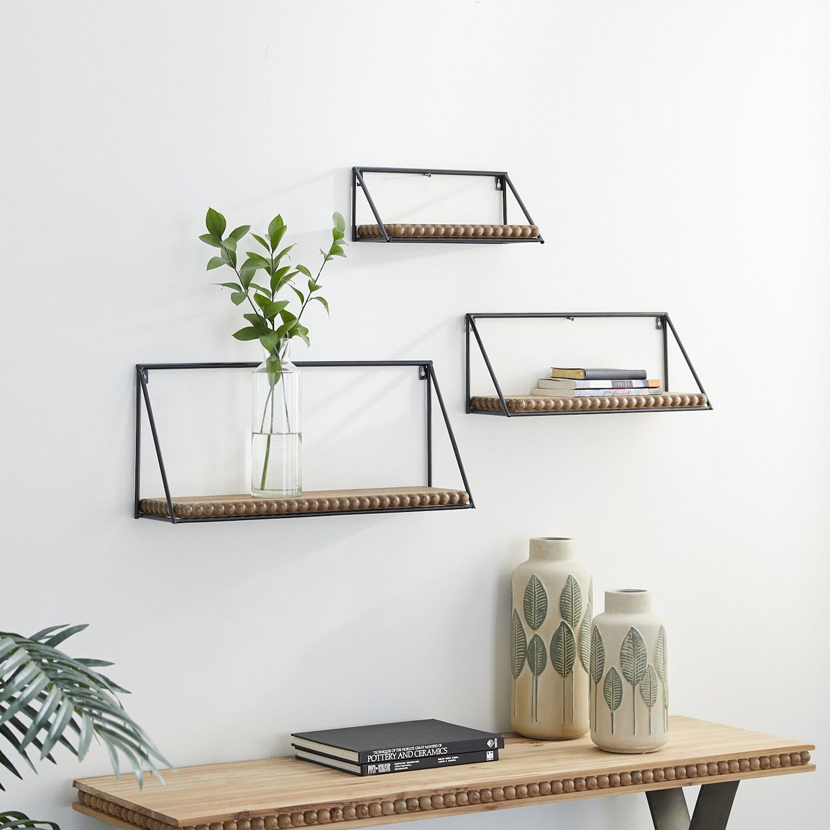 Stella & Eve beaded wall shelf set with black frames and bead trim