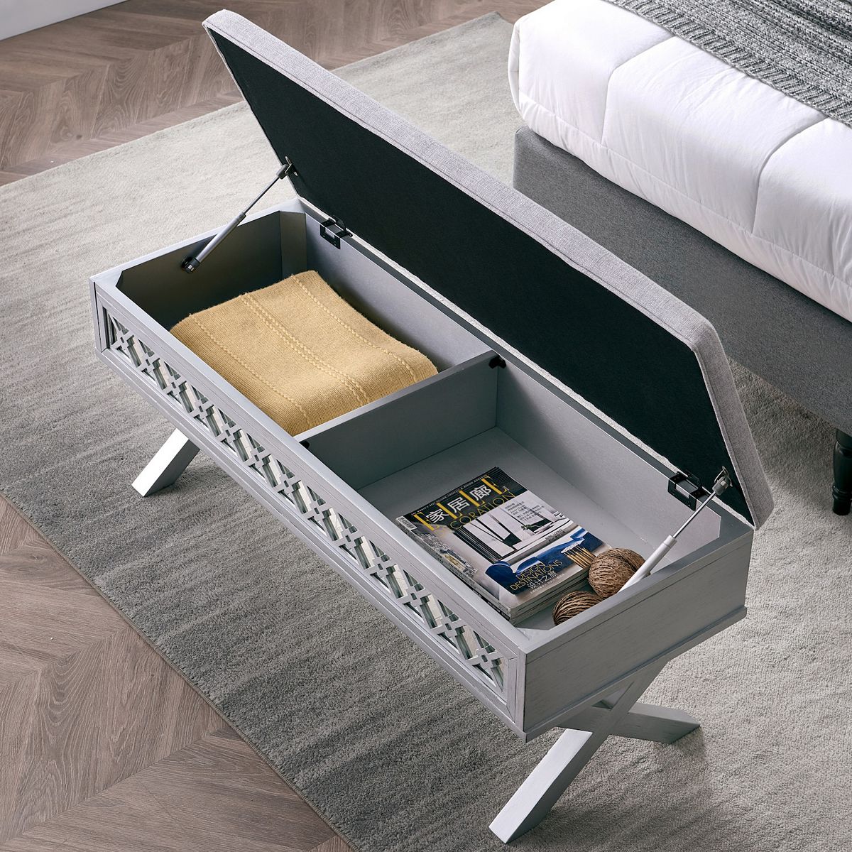 Storage bench with open lid showing interior compartments and beige cushion