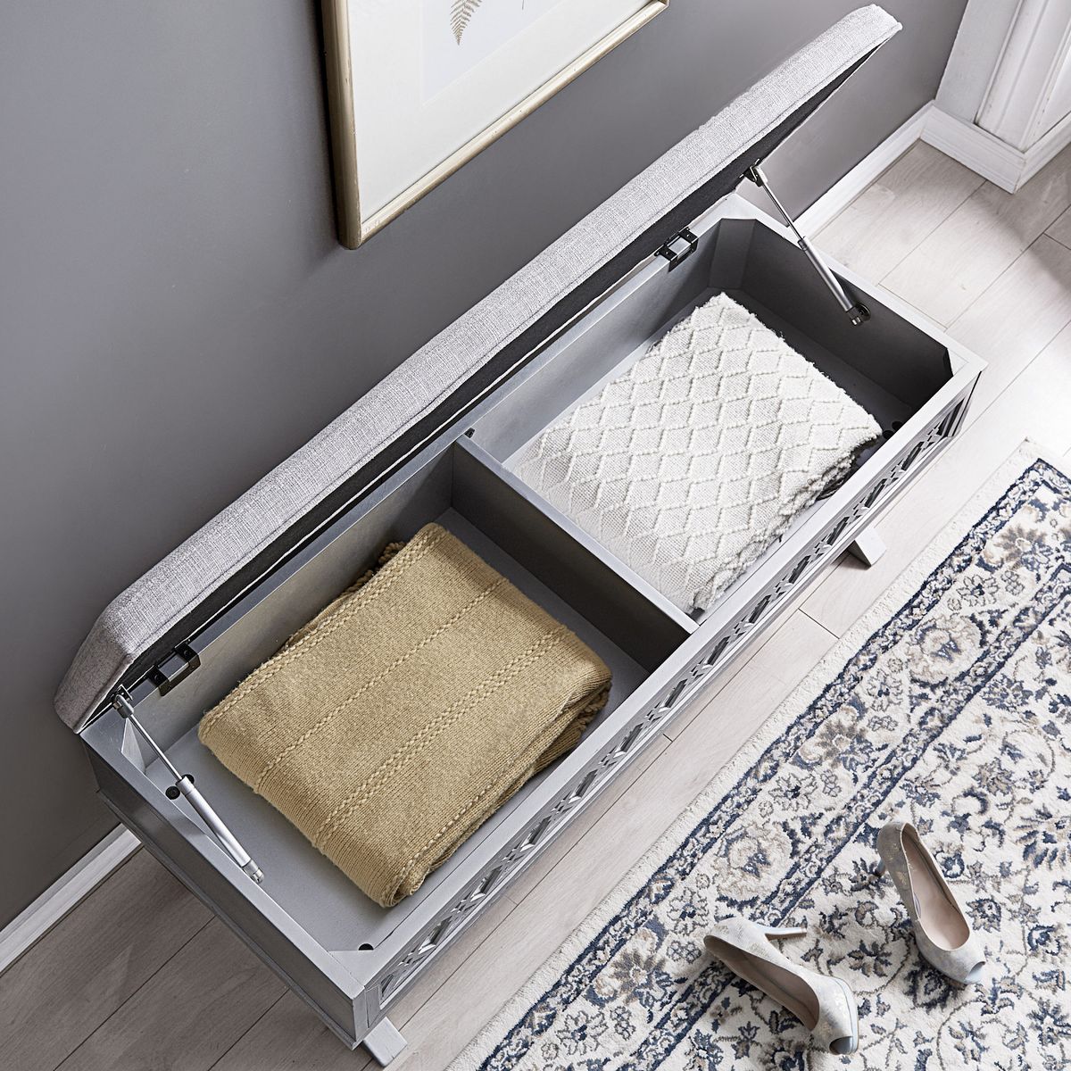 Open storage bench lid with interior tray and hinge hardware