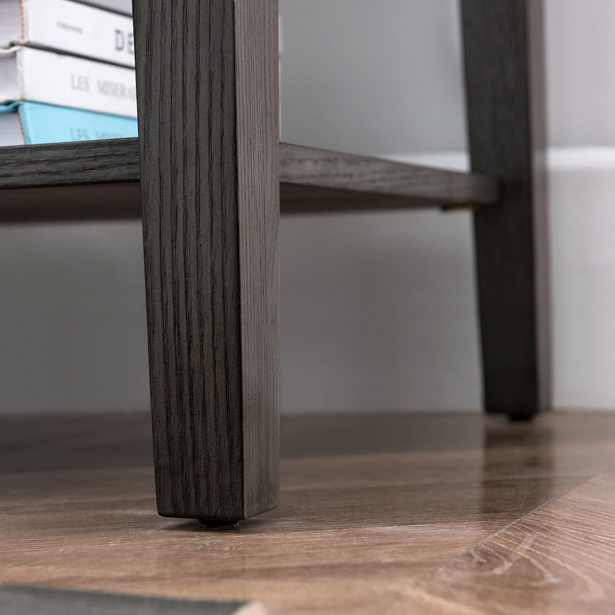 Bottom leg close-up of smoke gray oak nightstand side table