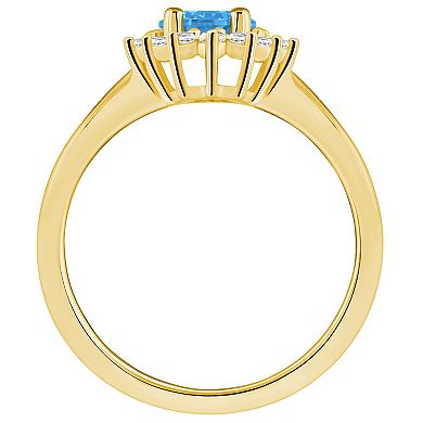 Alyson Layne 14k Gold Blue Topaz & 1/4 Carat T.W. Diamond Halo Ring