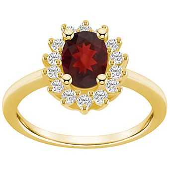 Alyson Layne 14k Gold Oval Cut Garnet & 1/3 Carat T.W. Diamond Halo Ring