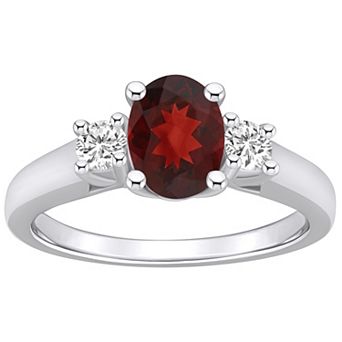 Alyson Layne 14k White Gold Oval Cut Garnet & 1/4 Carat T.W. Diamond Ring