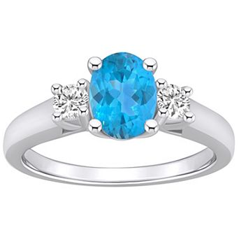Alyson Layne 14k White Gold Oval Cut Blue Topaz & 1/4 Carat T.W. Diamond Ring