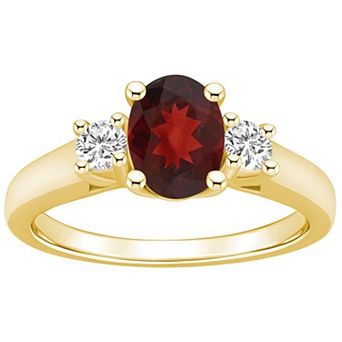 Alyson Layne 14k Gold Oval Cut Garnet & 1/4 Carat T.W. Diamond Ring