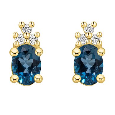 Alyson Layne 14k Gold Oval London Blue Topaz & 1/7 Carat T.W. Diamond Earrings