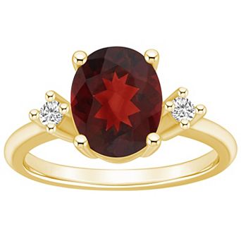 Alyson Layne 14k Gold Oval Garnet & 1/10 Carat T.W. Diamond Ring