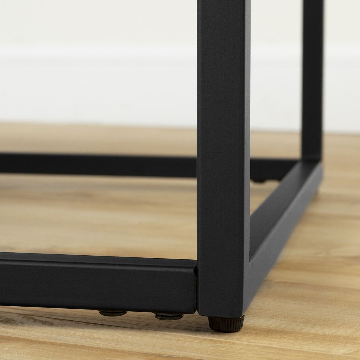 Black metal leg detail on modern industrial coffee table