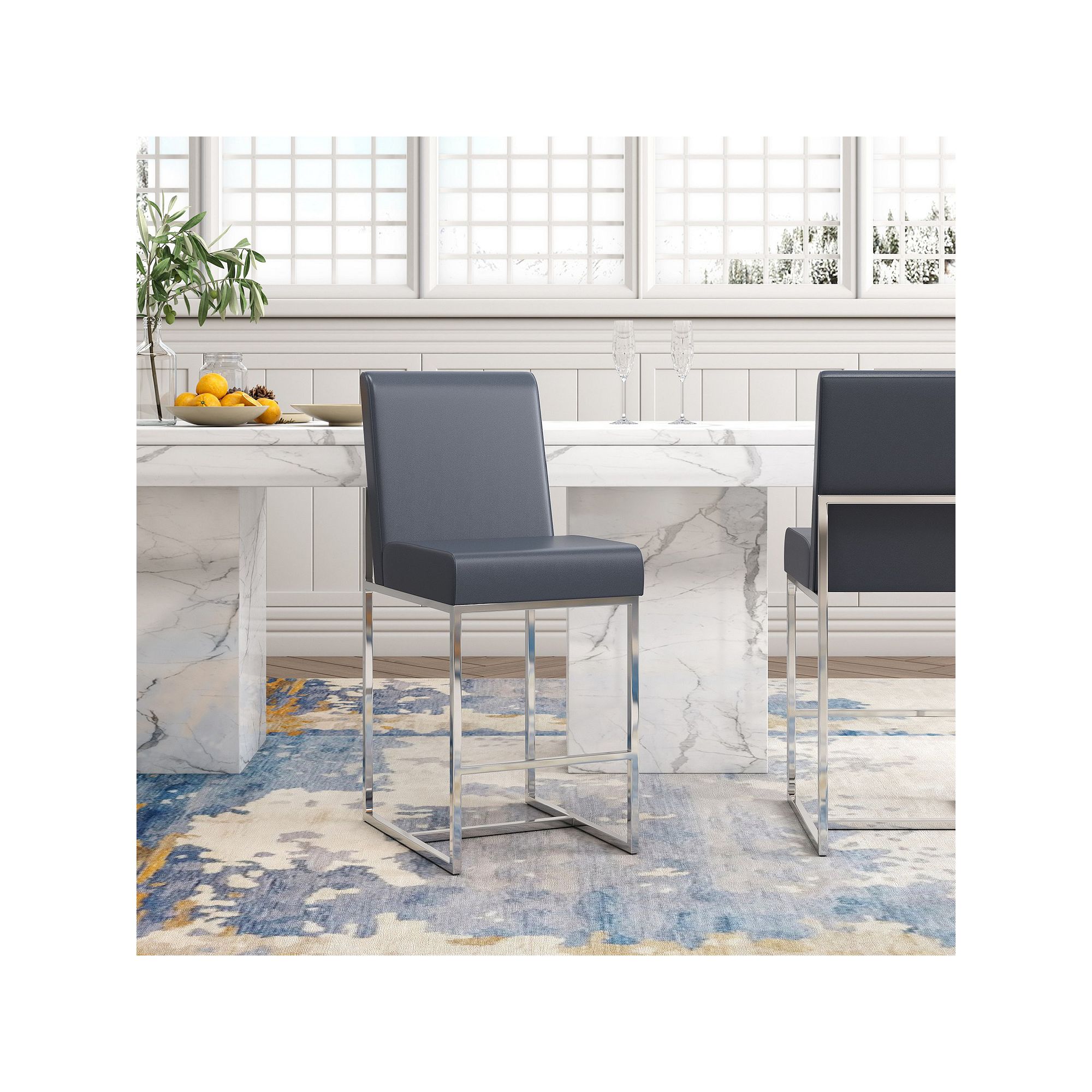 Bar stools in a dining setting with a marble table and blue rug.