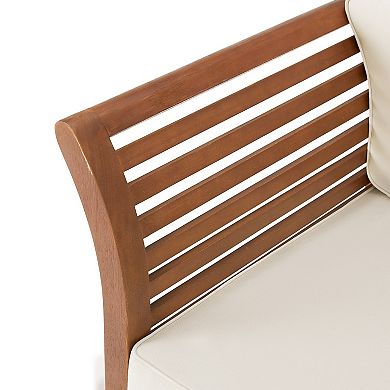 Close-up of brown chair back slats and armrest